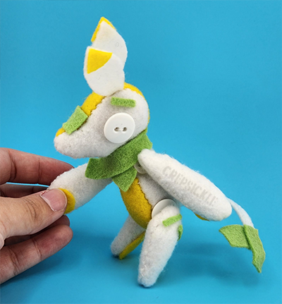 An egg and scallion themed felt creature
