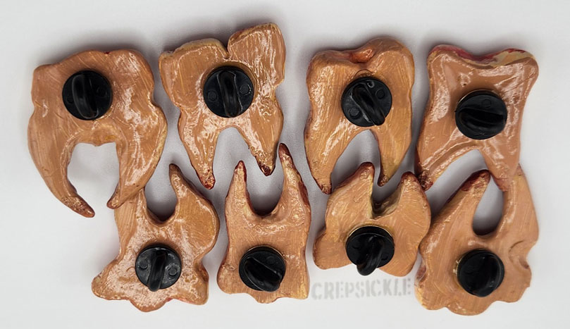 Pinned Backs of Various Painted Clay Teeth